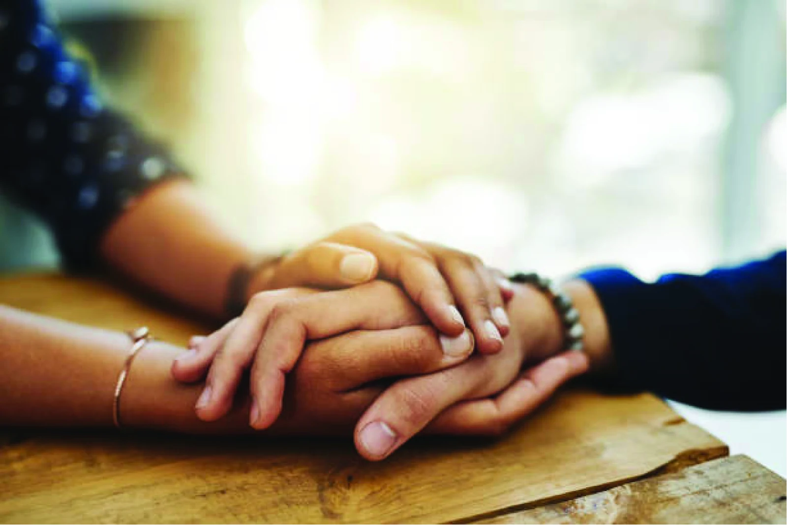 Hands held in a gesture of support.